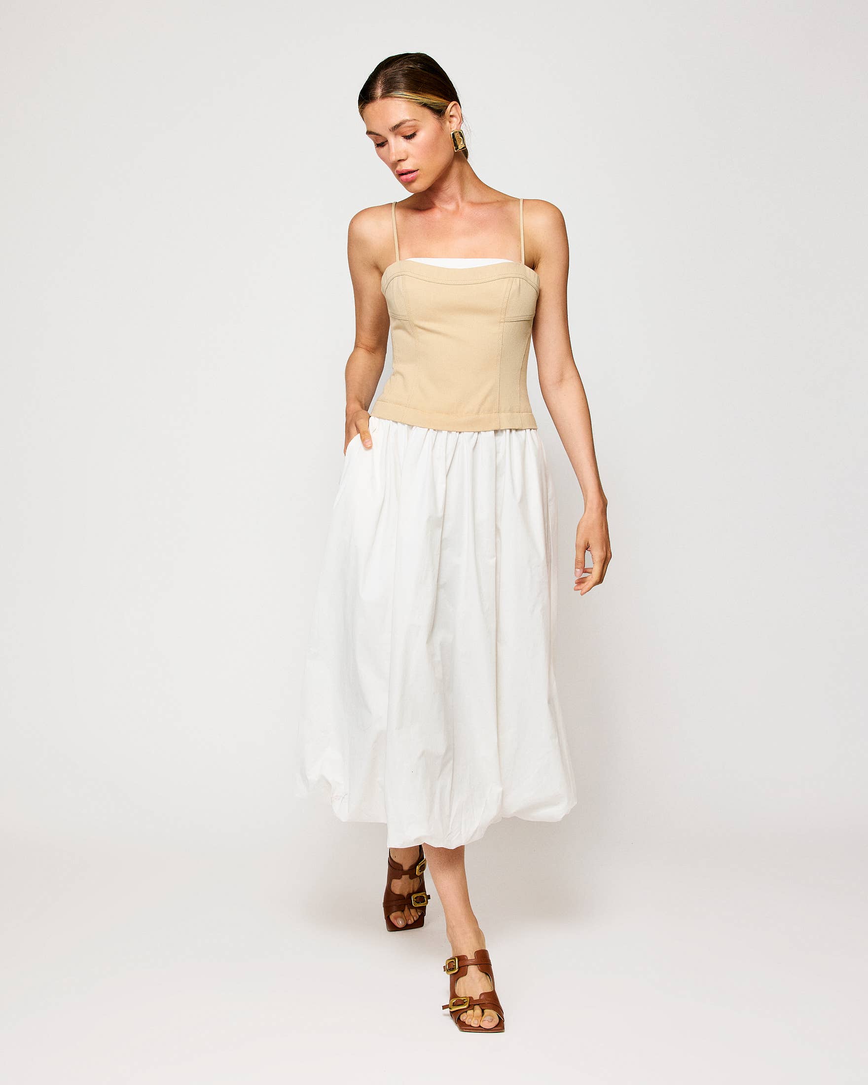 Elegant beige and white midi dress from women's boutique clothing, perfect for resort wear and summer collection events.