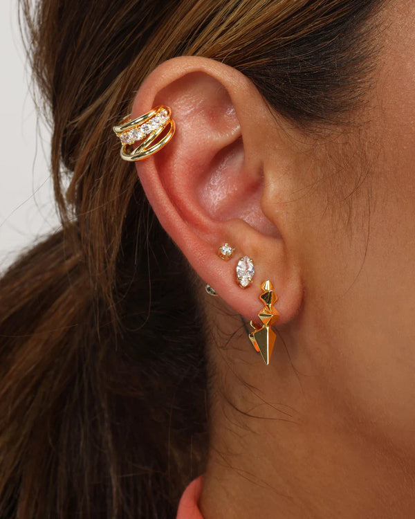 Layered diamond ear cuff in ear, showcasing modern women's jewelry from boutique collection. Perfect for summer fashion.