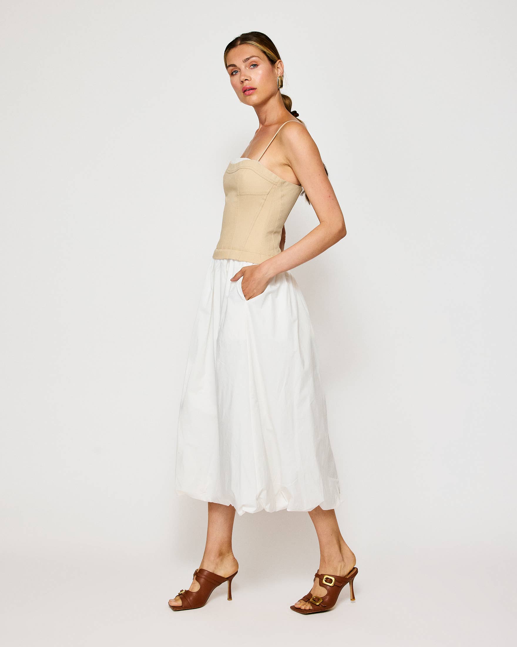 Elegant Anitha Dress in beige and white, perfect for resort wear or summer events, available at our women's boutique clothing.