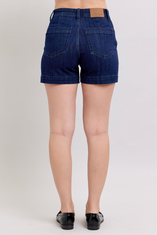 Back view of women's high waist dark blue trouser shorts, perfect for summer collection boutique. Stylish addition to casual outfits.