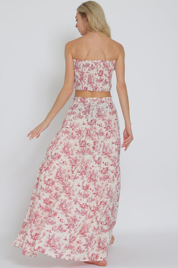 Elegant women's boutique clothing red smocked tube top and tiered maxi skirt set, perfect for summer resort wear.