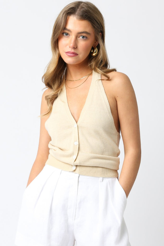 Chic tan halter v-neck knit top from women's boutique clothing, perfect for summer collection outfits and vacation wear.