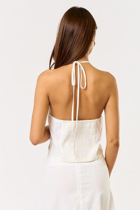 Women’s boutique clothing: White halter top with smocked back, perfect for summer collection, exclusive women's fashion.