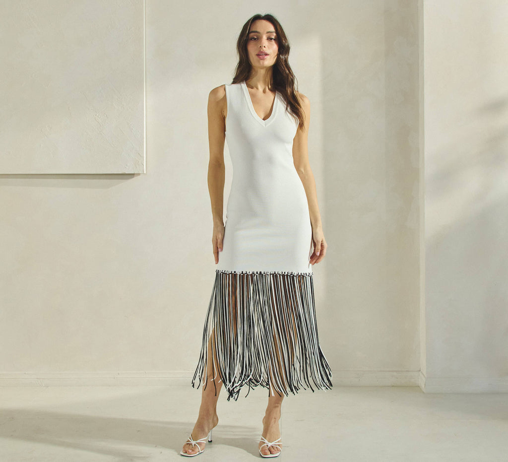 Stylish sleeveless V-neck off white two-tone fringe dress from women's boutique clothing, perfect for summer collection.