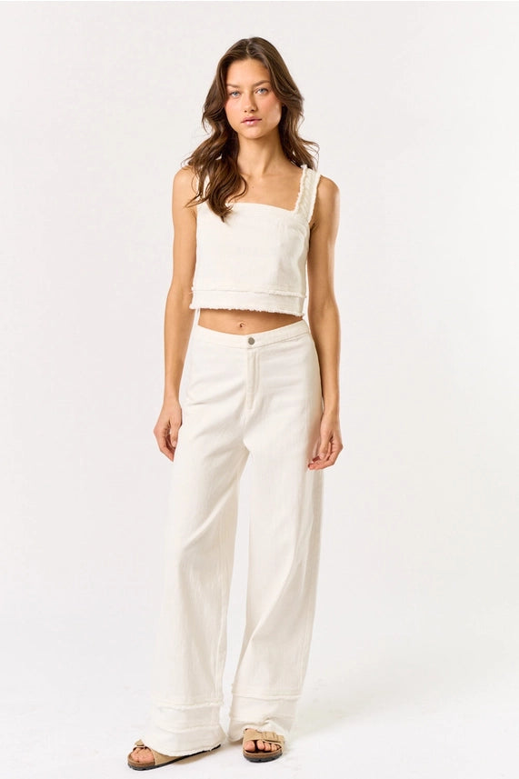 Woman in Off White Crop Fringe Detail Top & Wide Leg Pants Set, perfect for summer casual wear. Women's boutique clothing.