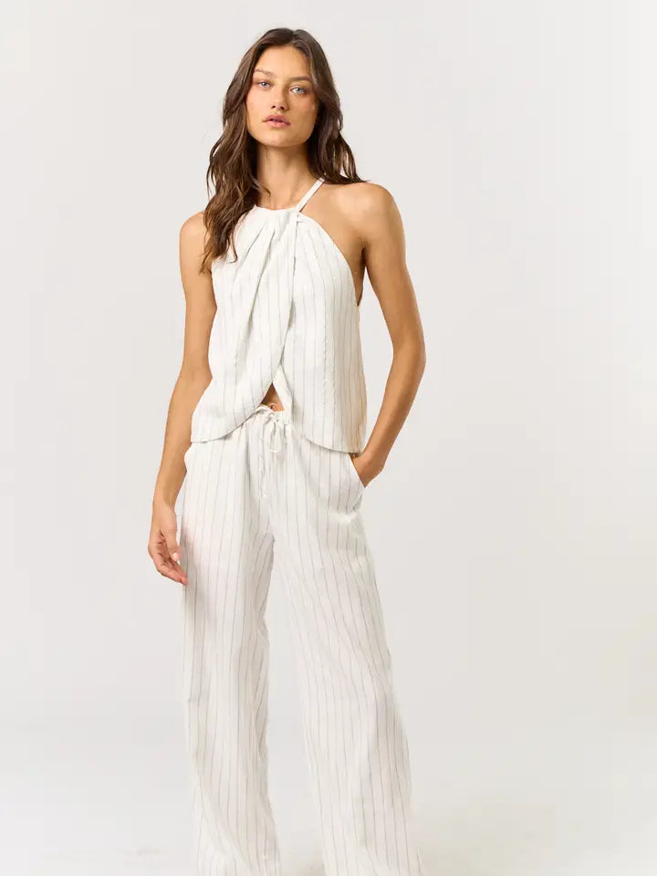 Chic off white and black striped halter top with drawstring pants, perfect for women's boutique clothing and summer collection.