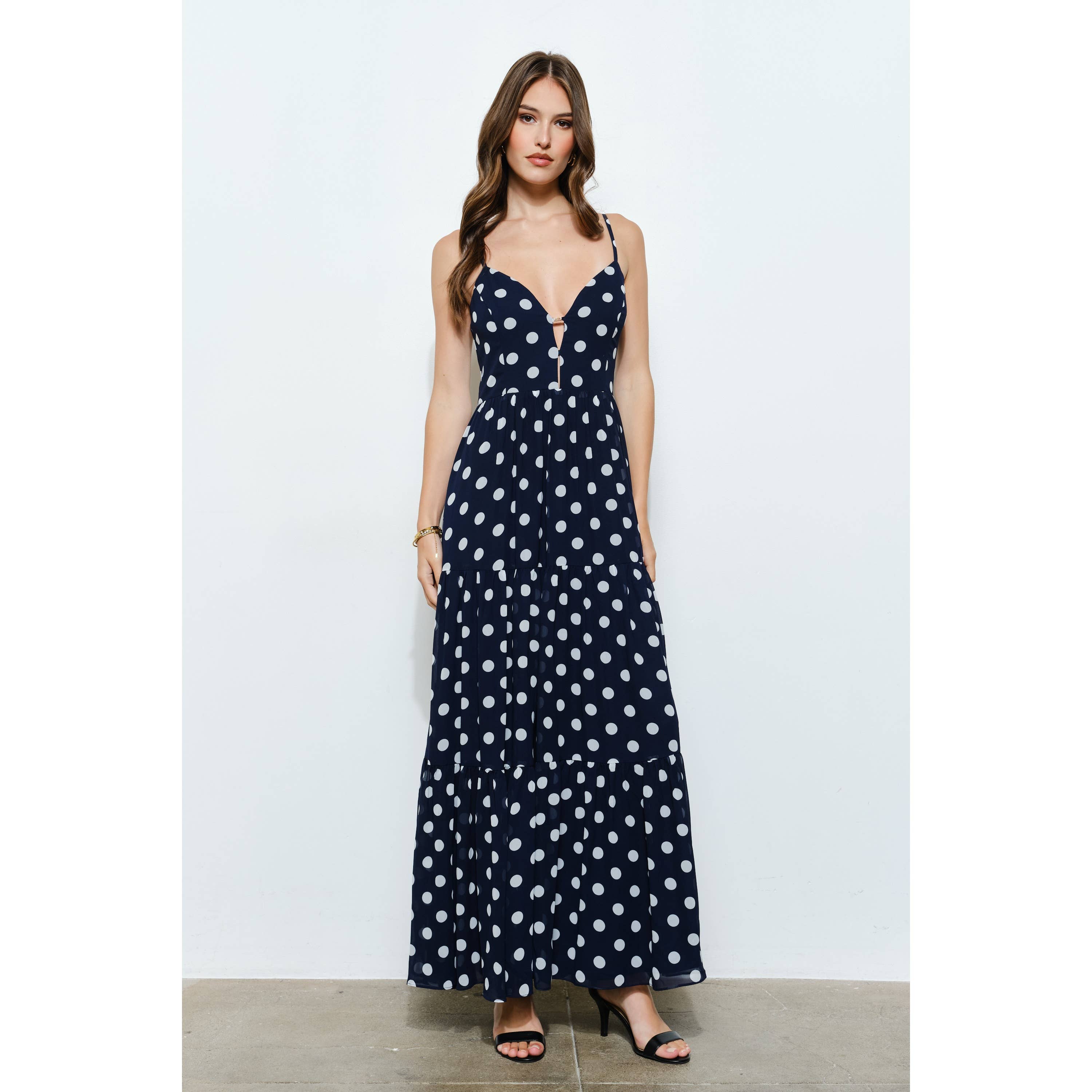 Gold metal accent navy polka dot tiered maxi dress for women's boutique clothing, perfect for summer collection or resort wear.