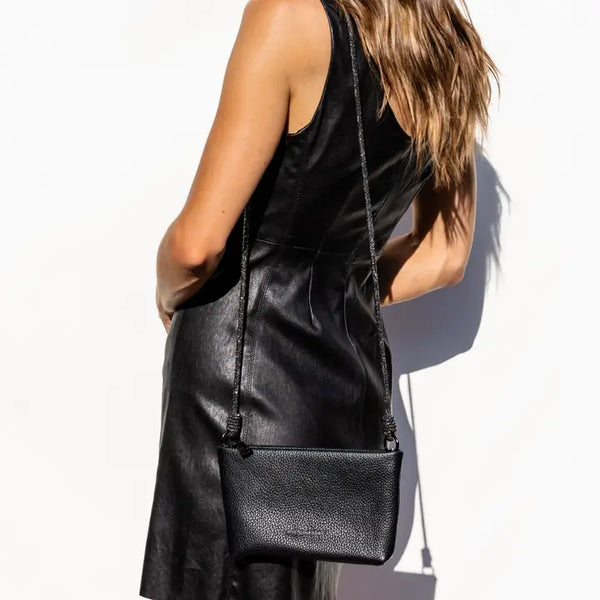 Model in black dress showcases Link Strap for handbags, perfect for exclusive women's fashion and summer collection boutique.