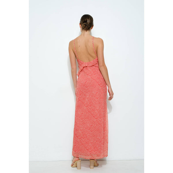Back view of a women's orange chiffon ruffled polka dot slip maxi dress, perfect for resort wear in the summer collection boutique.