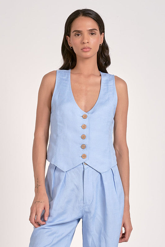 Light blue sleeveless vest with deep V-neck and wooden buttons, perfect for women's boutique clothing and summer collection outfits.