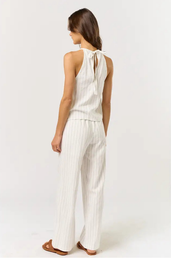 Women's boutique clothing featuring off white & black striped halter top with elastic waistband pants, perfect for summer.