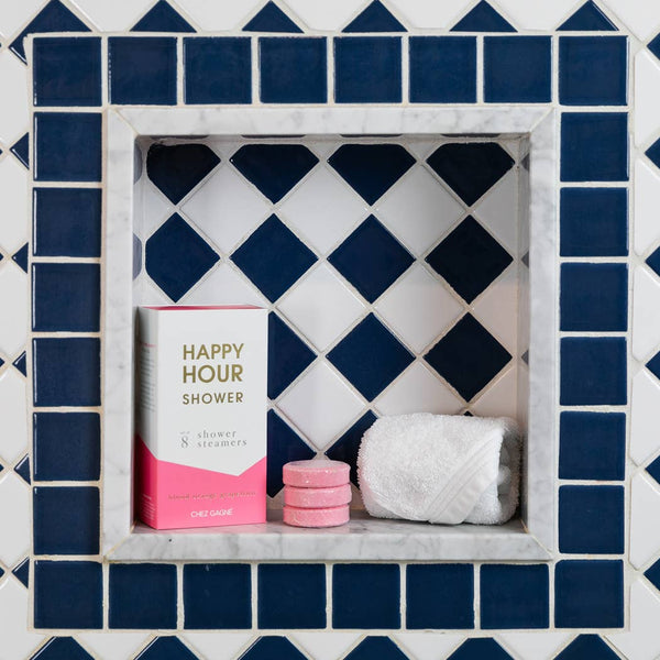 Happy Hour Shower Steamers set in a stylish bathroom alcove, perfect for a refreshing aromatherapy experience.