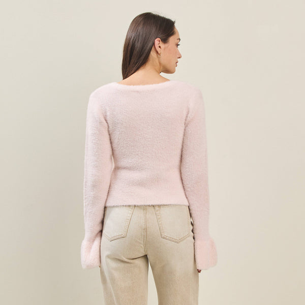 Back view of a women's fuzzy cardigan with bow buttons, perfect for summer collection boutique and new arrivals in women's fashion.