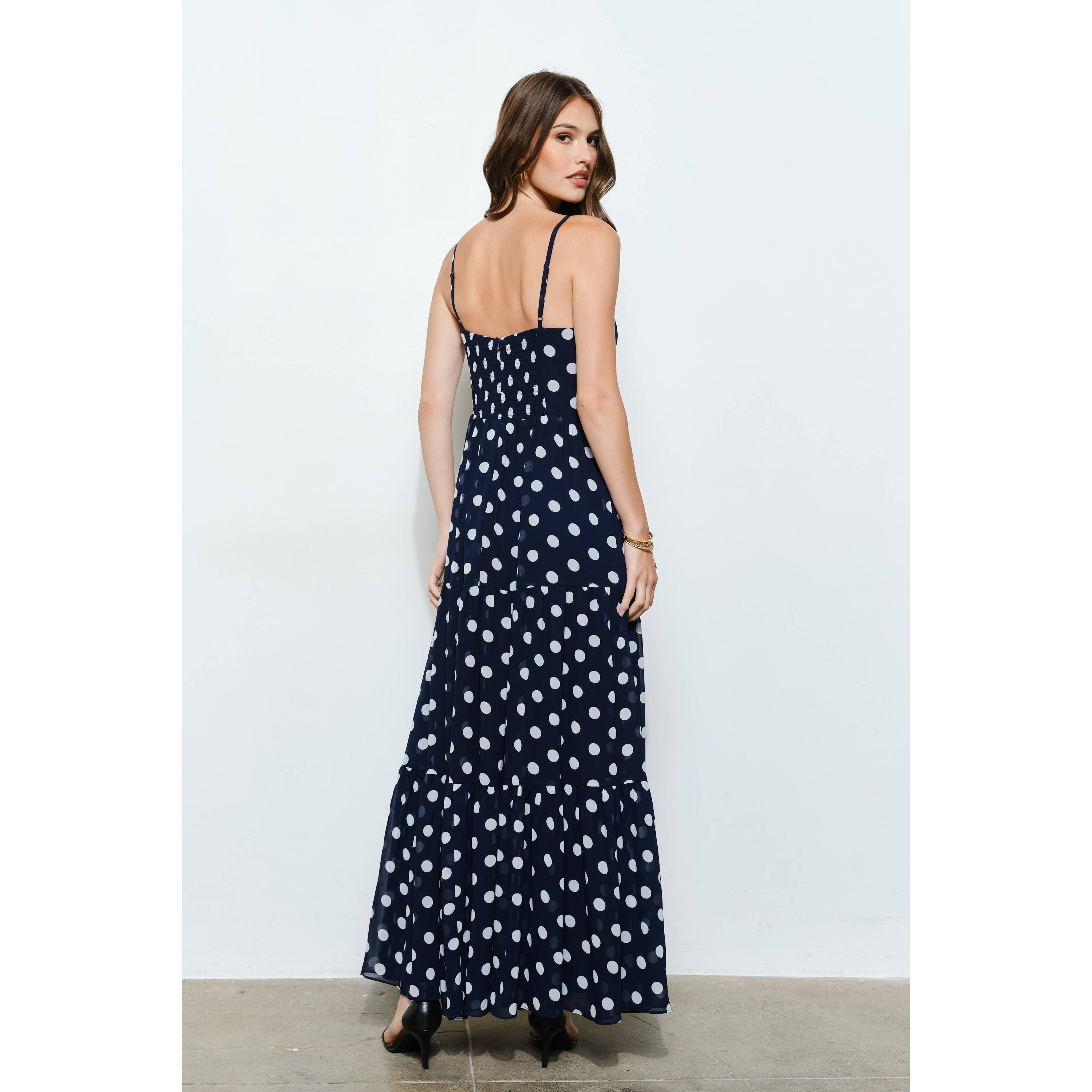 Navy/white polka dot tiered maxi dress with adjustable straps, perfect for women's boutique fashion and summer collection styles.