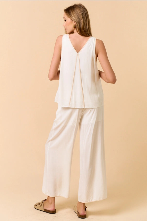 Stylish off white sleeveless top with matching wide-leg pants, perfect for women's boutique clothing and summer collection.