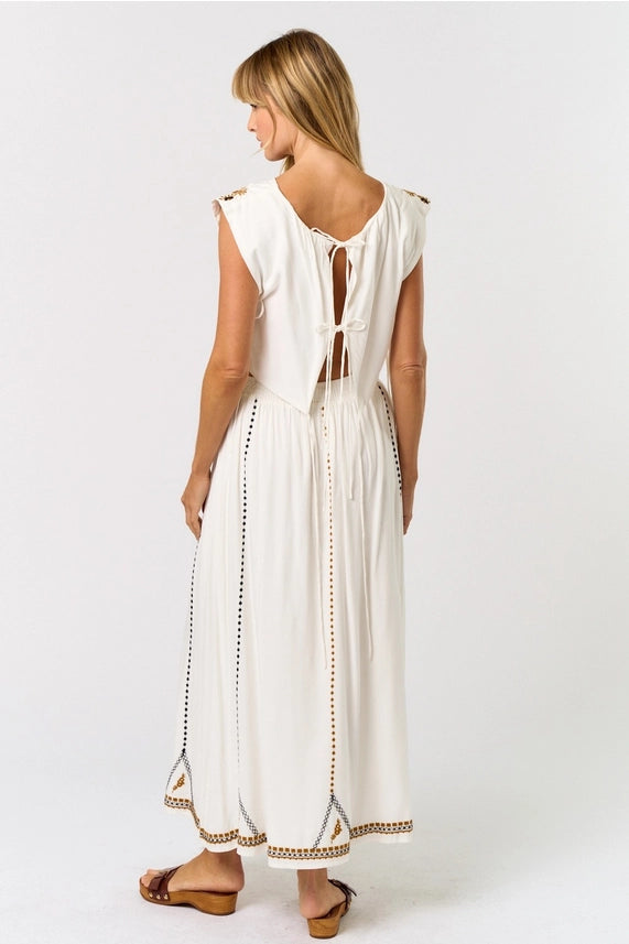 Women's boutique clothing - Boho embroidered crop top with open back ties and matching maxi skirt, perfect for resort wear.