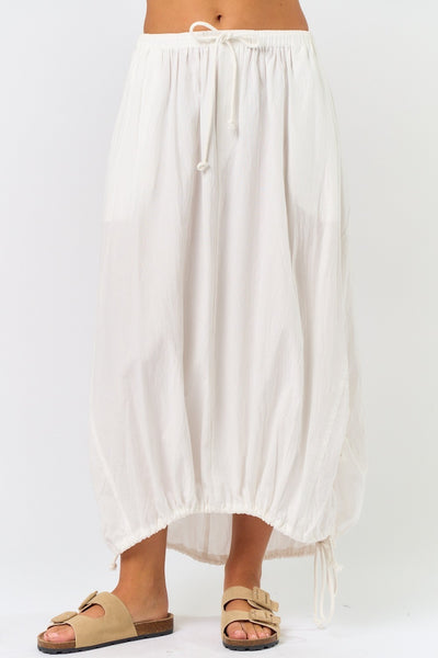 White parachute skirt with drawstring waist and rope detail, perfect for summer collection in women's boutique clothing.
