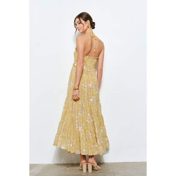 Back view of chic smocked tropical halter maxi dress, perfect resort wear for summer collection. Women's boutique clothing.