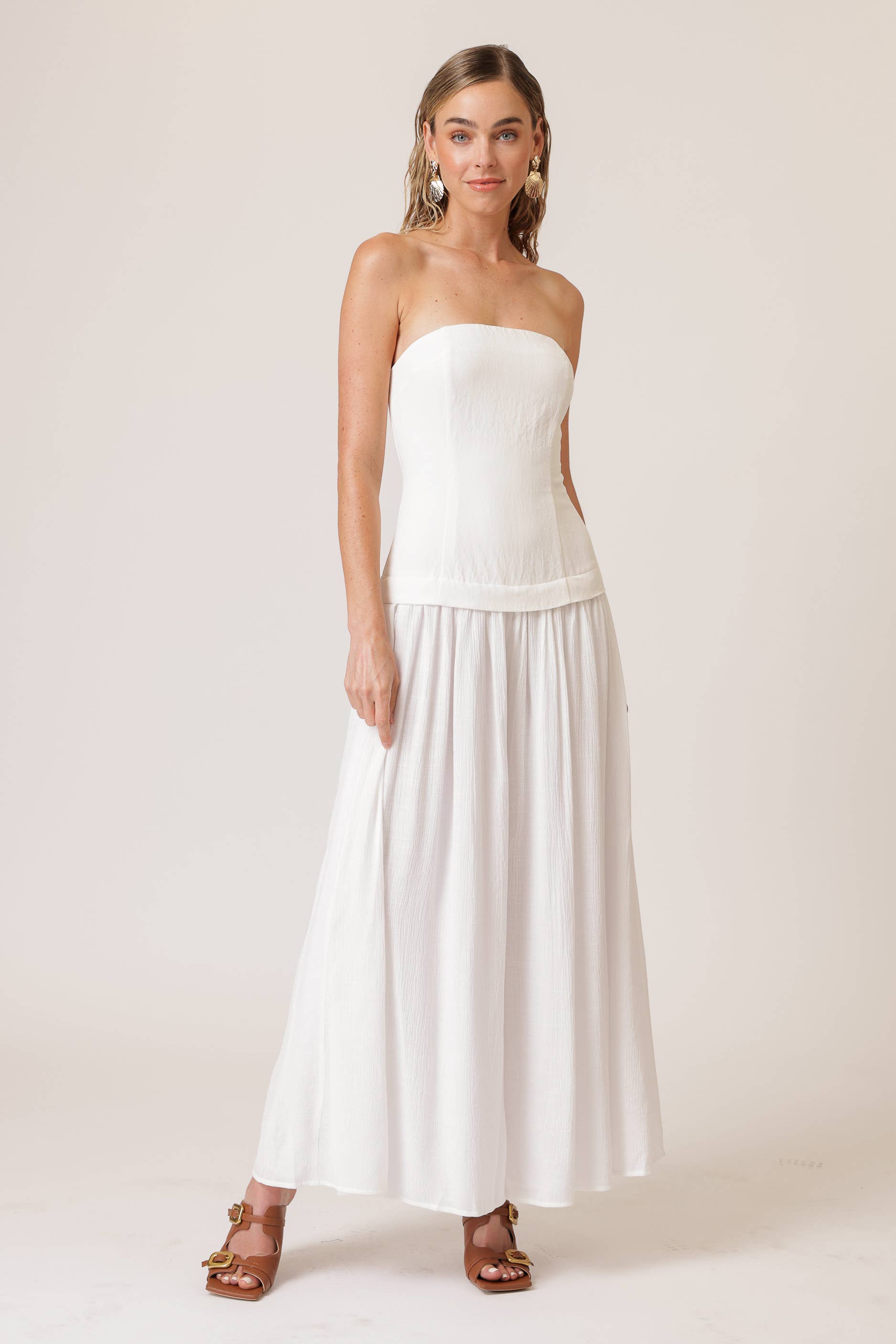 Chic white strapless jumpsuit for women, perfect for resort wear. Ideal for summer collection boutiques and new arrivals.