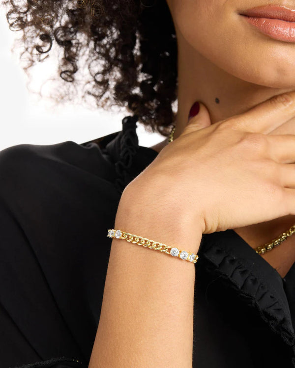 Model wearing Baby Julian's Obsessed with Diamonds Bracelet, featuring simulated diamonds and gold plating, perfect for summer collection.