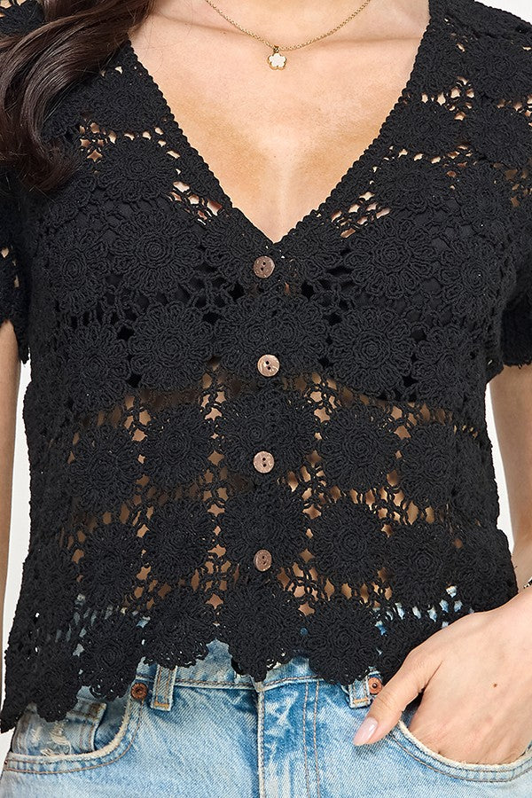 Black crochet short sleeve V-neck button top with floral patterns, perfect for women's boutique clothing and summer collection.