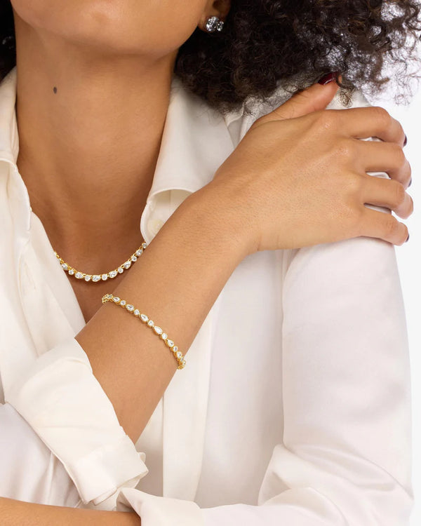 Model showcasing Isla Tennis Bracelet and matching jewelry, perfect for resort wear and women's boutique fashion.