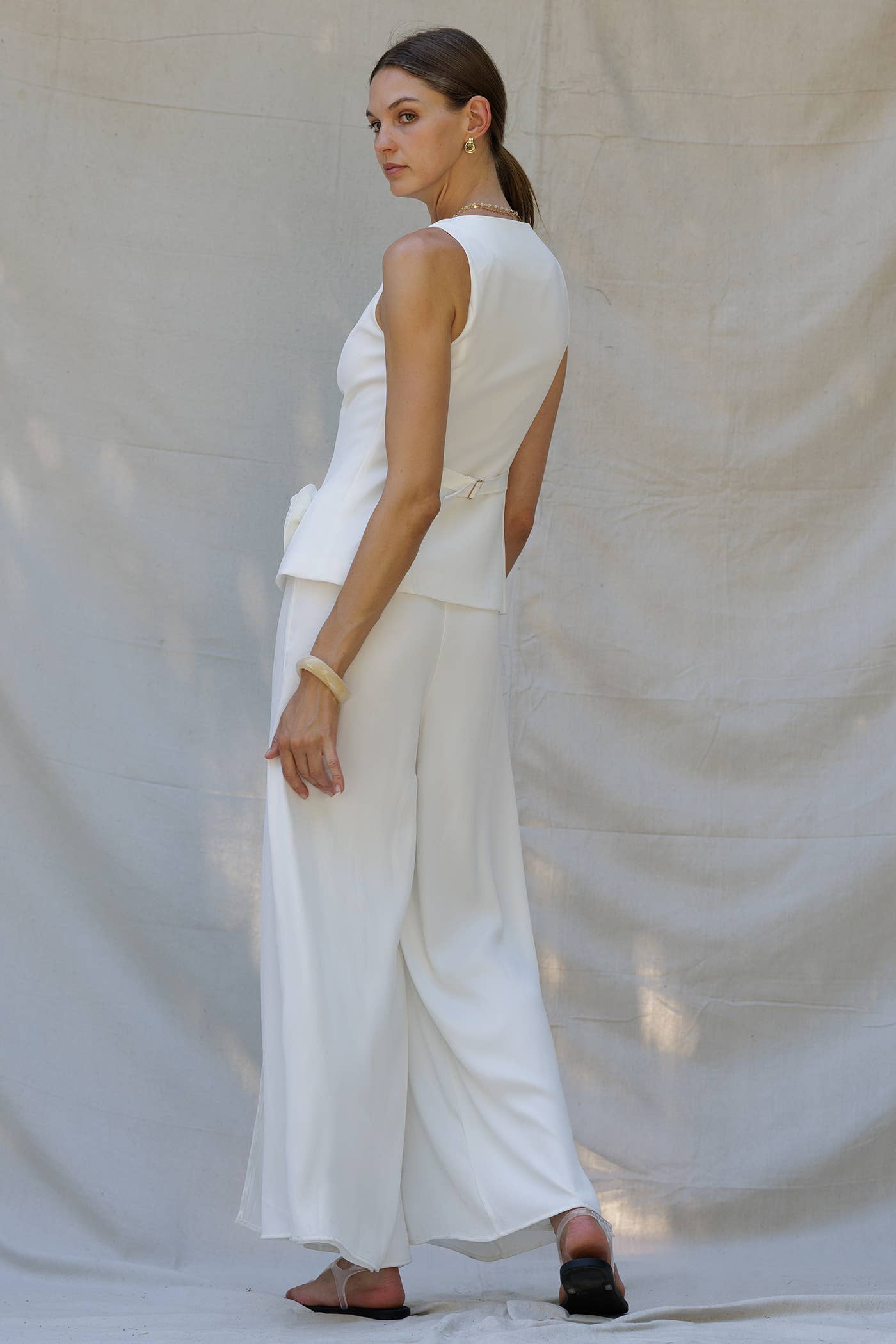 Women's boutique clothing: Rosette Peplum White Two-Piece Set, perfect for summer collection, resort wear, and new arrivals.