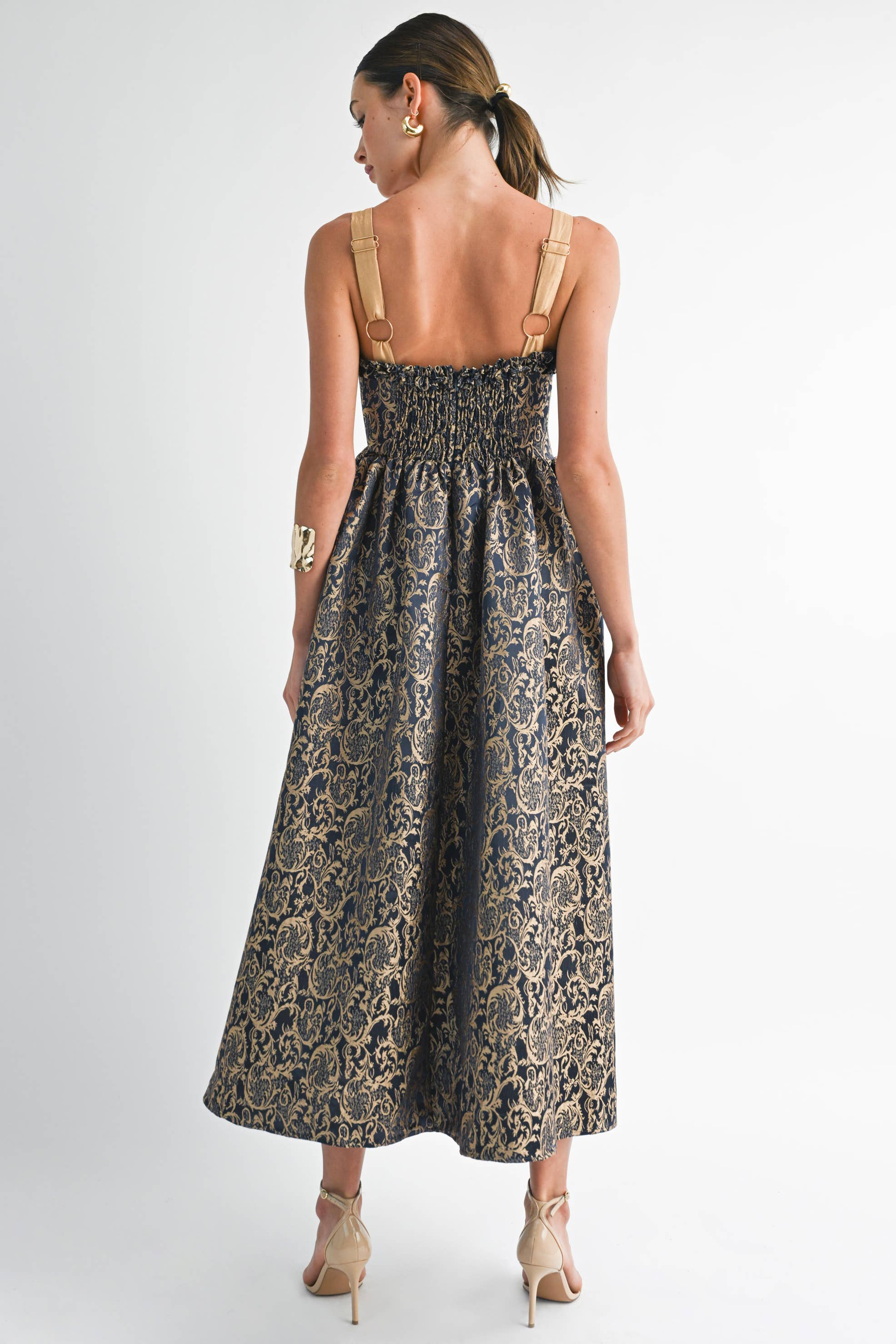 Back view of women's gold and navy damask midi dress with smocked bodice, perfect for summer collection boutique fashion.