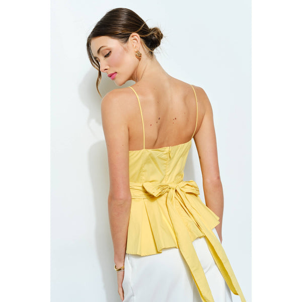 Women's boutique clothing: Cotton Draped Bow-Tie Peplum Cami Top in yellow, perfect for summer collection and resort wear.