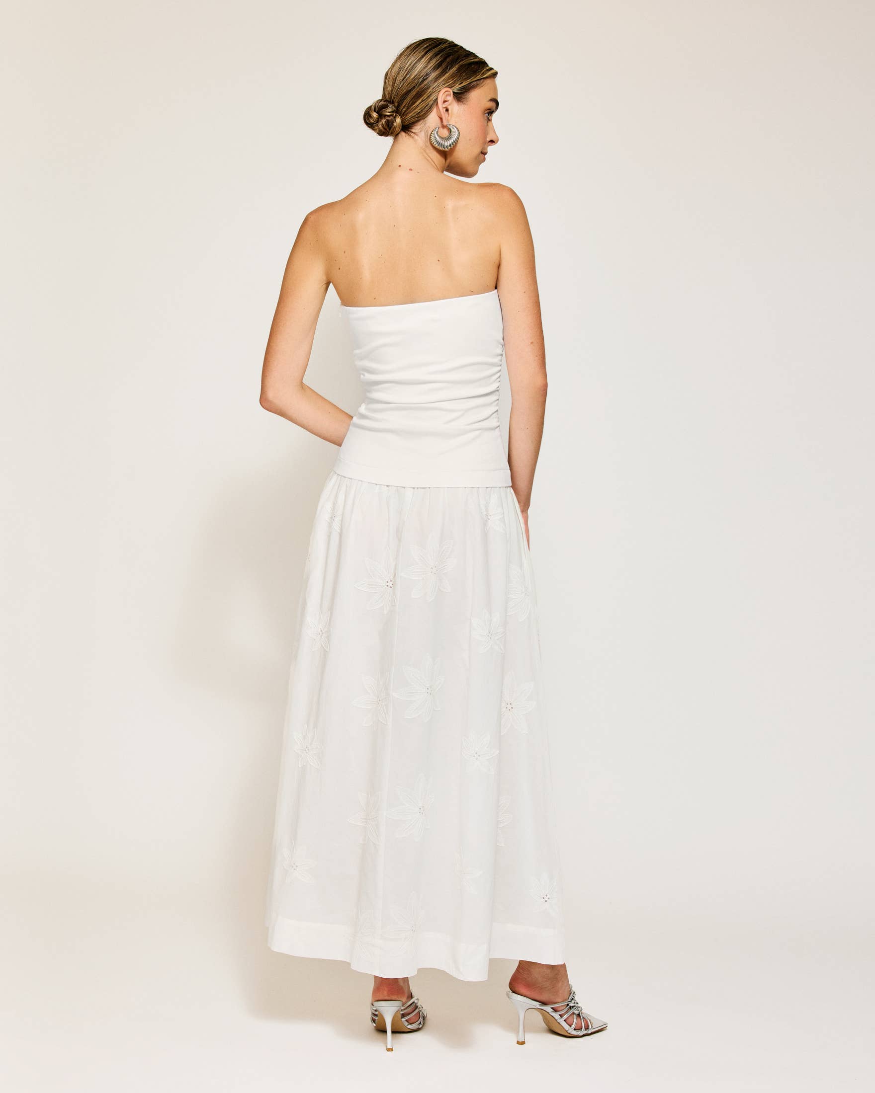 Back view of Emberly strapless white maxi dress, perfect for summer collection boutique and resort wear dresses.
