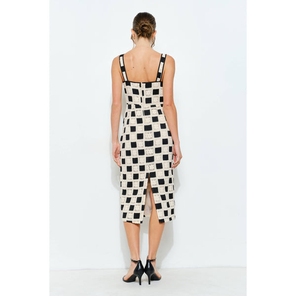 Back view of a sleeveless square lace panel midi dress with checkerboard design, perfect for women's boutique clothing.
