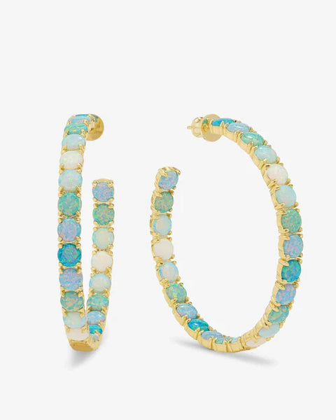 Stylish 2" ombre hoop earrings with simulated blue opal stones. Perfect for summer collection from women's boutique clothing.