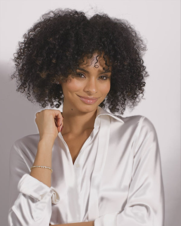Model wearing Isla Tennis Bracelet with a stylish white blouse, perfect for summer collection boutique and women's jewelry.