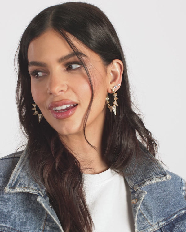 Stylish woman wearing Mama Gabriella Pave Spiked Hoop Earrings, perfect for summer collection boutique and new arrivals.