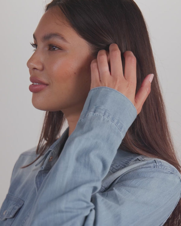 Model showcasing denim shirt for women's boutique clothing, perfect for summer collection and casual style.