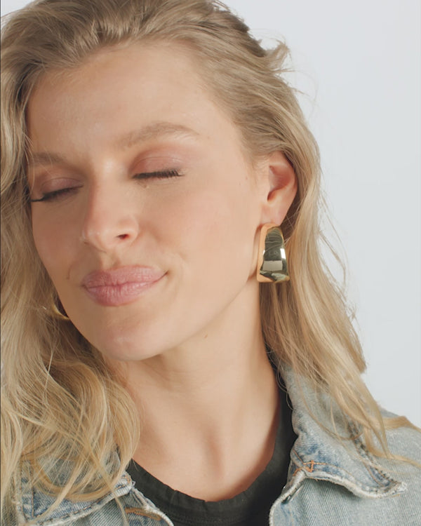 Woman wearing She's So Smooth Mama Hoops earrings, perfect for women's boutique clothing and summer collection.